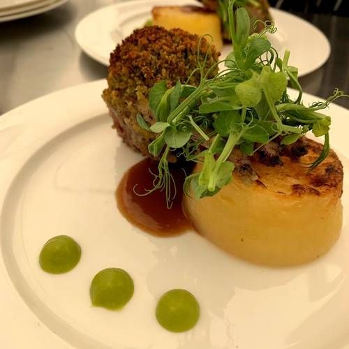 Herb crusted rack of lamb, pea puree, rosemary jus and fondant potatoes 